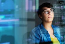 young computer programmer looking through data
