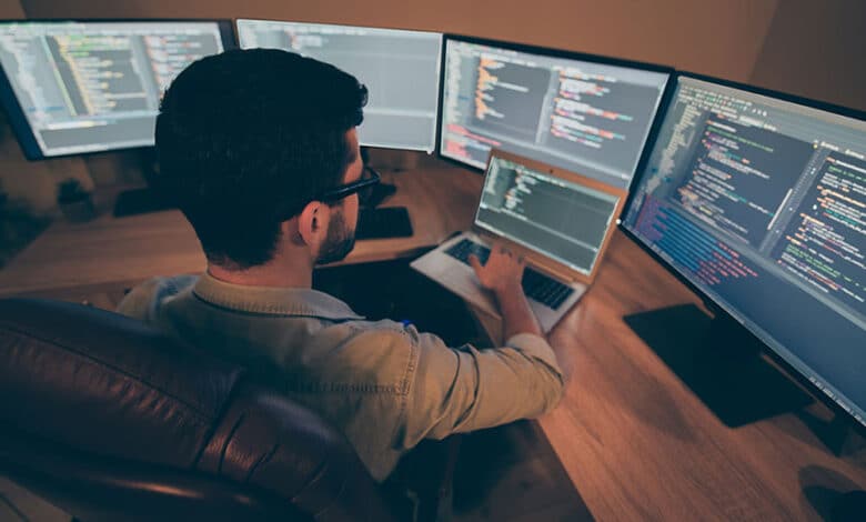 Developer workstation showing multiple coding environments reflecting growing open-source dependency complexity in AI-assisted development